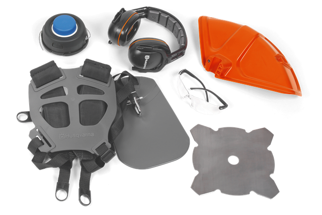 Top view of various Husqvarna protective gear and accessories including ear protection, safety glasses, and harness.